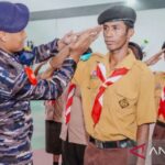 Anggota Pramuka Ambon mengikuti Bela Negara pada perkemahan Sabtu Minggu. Foto Antara
