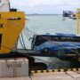 Sebuah bus memasuki kapal feri di pelabuhan penyeberangan. Foto Antara