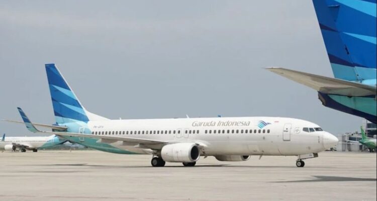 Pesawat Garuda Indonesia berada di area apron bandara. Sumber foto: Antara