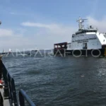 Crew members of the Marine and Fisheries Surveillance Directorate (PSDKP) of Indonesia's Ministry of Marine Affairs and Fisheries salute the marine and fisheries patrol vessel Orca 02 at the Former Presidential Pier in Tanjung Priok, North Jakarta, on Thursday, February 1, 2024. Antara Photo