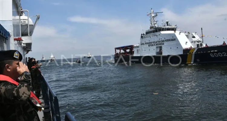 Crew members of the Marine and Fisheries Surveillance Directorate (PSDKP) of Indonesia's Ministry of Marine Affairs and Fisheries salute the marine and fisheries patrol vessel Orca 02 at the Former Presidential Pier in Tanjung Priok, North Jakarta, on Thursday, February 1, 2024. Antara Photo