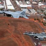 Indonesian Air Force (TNI AU) Chief of Staff Air Marshal Mohamad Tonny Harjono aboard a T-50i fighter jet (right) maneuvers in mid-air alongside Royal Australian Air Force (RAAF) Chief of Air Force Air Marshal Stephen Chappell flying an F/A-18 Hornet (left) over the skies of Darwin, Australia, on Tuesday (August 4, 2026). Photo source: Antara News Agency