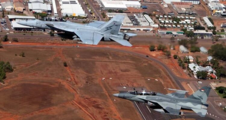 Indonesian Air Force (TNI AU) Chief of Staff Air Marshal Mohamad Tonny Harjono aboard a T-50i fighter jet (right) maneuvers in mid-air alongside Royal Australian Air Force (RAAF) Chief of Air Force Air Marshal Stephen Chappell flying an F/A-18 Hornet (left) over the skies of Darwin, Australia, on Tuesday (August 4, 2026). Photo source: Antara News Agency