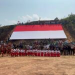 Participants unfold a giant Indonesian flag during an Independence Day parade in Jagoi Babang, Bengkayang District, West Kalimantan. Photo Source: Antara News Agency
