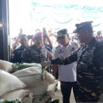 Commander of the Indonesian Fleet Command (Pangkoarmada RI) Vice Admiral Denih Hendrata (right), accompanied by Bangka Belitung Governor Hidayat Arsani (center) and Bangka Belitung Naval Base Commander Colonel (Mar) Yulindo (left), inspects evidence of illegal tin sand intercepted while being smuggled from Belitung to Malaysia, in Tanjungpandan, on Thursday (August 20, 2026). Photo Source: Antara News Agency