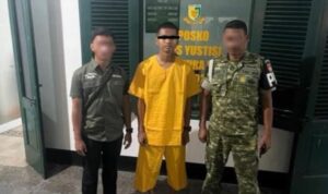 Letda Inf AG (berbaju kuning), tersangka kasus meninggalnya Letda Inf Jihad Ahmad Al-Rasyid di Gudang Senjata Grup 2 Kopassus, Kartasura, Sukoharjo, Jawa Tengah menjalani proses hukum, Jumat (30/10/2026). Sumber foto: Antara Letda Inf AG (berbaju kuning), tersangka kasus meninggalnya Letda Inf Jihad Ahmad Al-Rasyid di Gudang Senjata Grup 2 Kopassus, Kartasura, Sukoharjo, Jawa Tengah menjalani proses hukum, Jumat (30/10/2026). Sumber foto: Antara